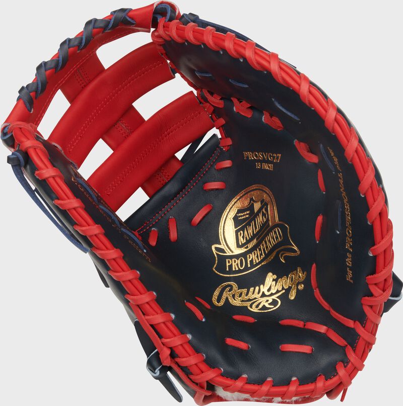 Palm of a navy/scarlet Vladimir Guerrero Jr. Pro Preferred 13-Inch 1st Base Mitt with gold stamping and navy laces