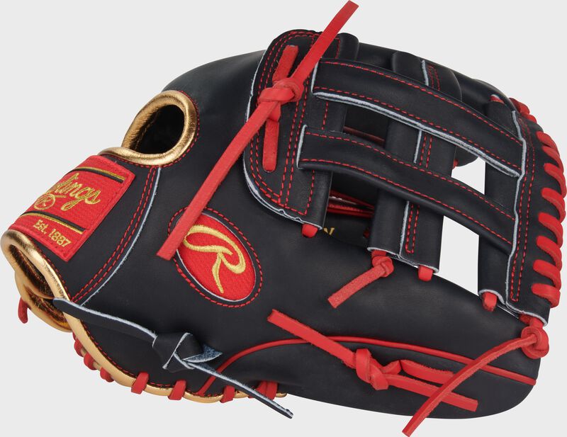Navy thumb of a Nolan Arenado Heart of the Hide 12-Inch Infield Glove with a navy Pro H-web