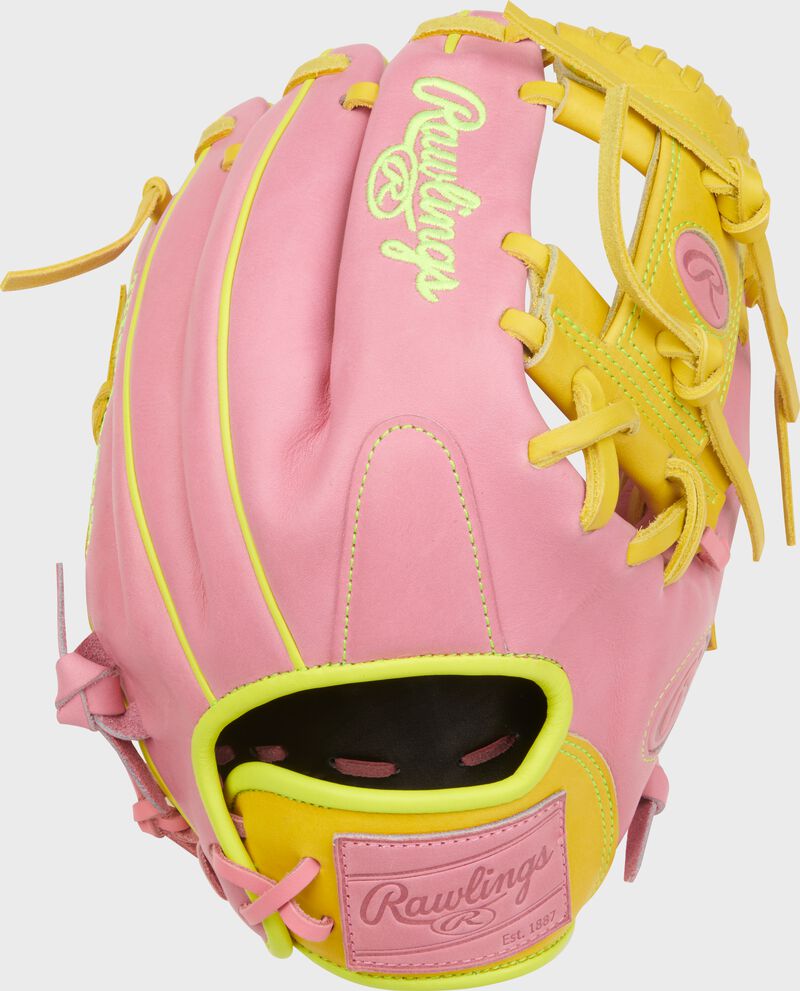 Pink back of a Heart of the Hide ContoUR Fit 11.5-Inch ink infield glove with a pink leather Rawlings patch