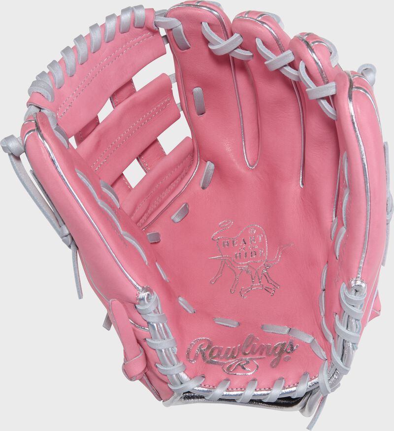 Palm of a pink Gameday 57 Series Carlos Correa Heart of the Hide glove with white laces