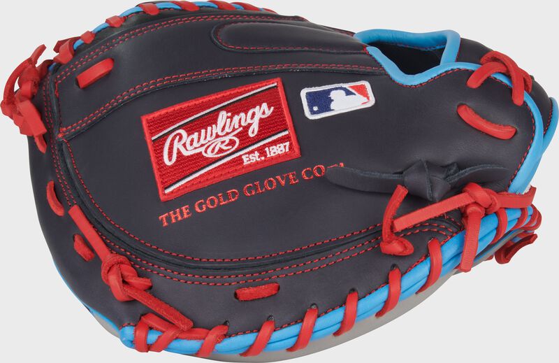 Back of a navy Rawlings NXT Series 32.5-Inch Catcher's Mitt with a red Rawlings patch loading=