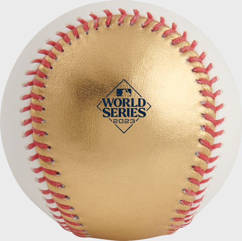 2023 World Series logo stamped on a gold panel of a 2023 World Series Champions baseball