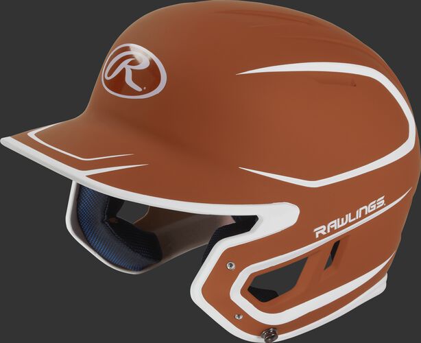 Left angle view of a Rawlings MACH Junior helmet with a two-tone matte orange/white shell