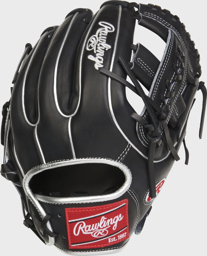 Back of a black Carlos Correa Heart of the Hide glove with a red Rawlings patch - SKU: PRO315-19CC4 loading=