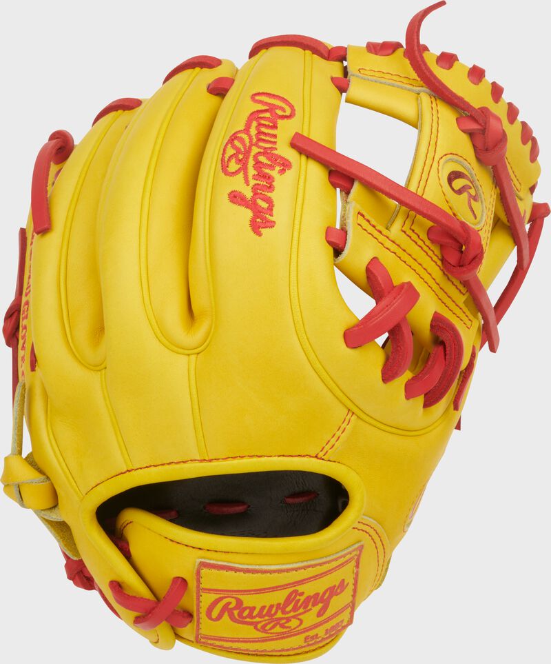 Back of a yellow Heart of the Hide ContoUR Fit 11.5-Inch Infield Glove with a yellow Rawlings patch