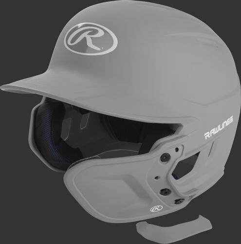 A matte silver MEXT attached to a Mach batting helmet showing the hardware