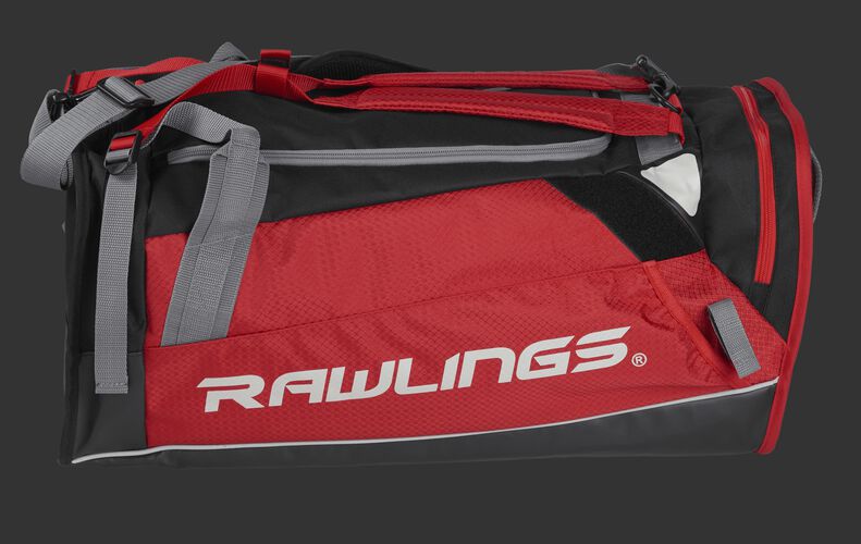 Side of a scarlet R601 Hybrid backpack/duffel players bag with black trim and a white Rawlings logo on the bat sleeve