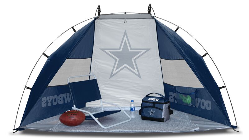 A Dallas Cowboys sideline sun shelter set up with a cooler, football, chair and water bottle on the ground - SKU: 00961065111