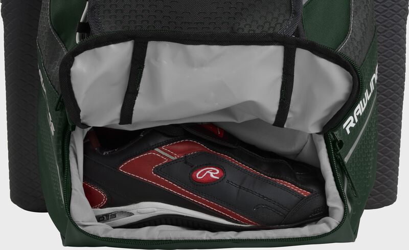 A dark green Rawlings baseball backpack with a cleat in the bottom cleat storage compartment - SKU: IMPLSE-DG loading=