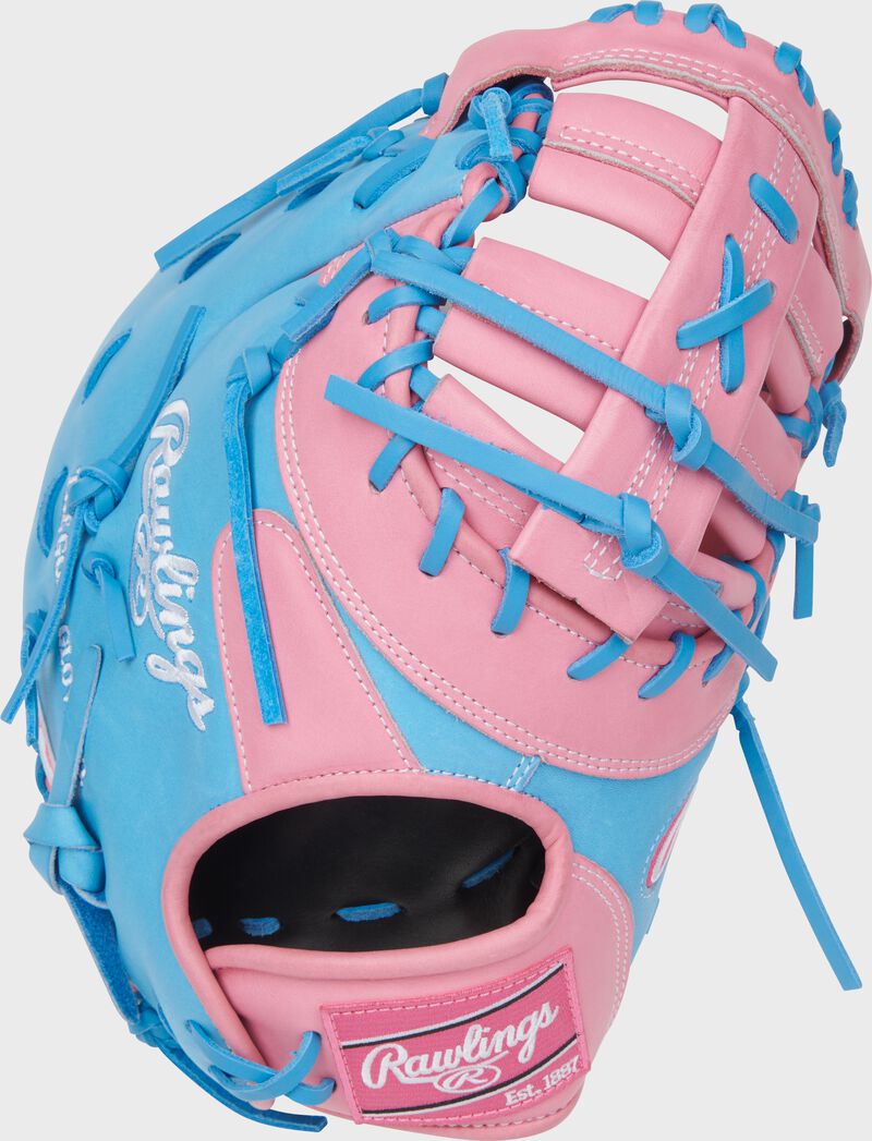 Columbia blue back of a Heart of the Hide ContoUR Fit 12.25-Inch 1st Base Mitt with a pink Rawlings patch