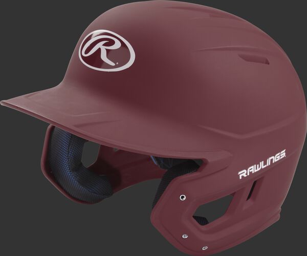 Left angle view of a Rawlings MACH helmet with a one-tone matte maroon shell