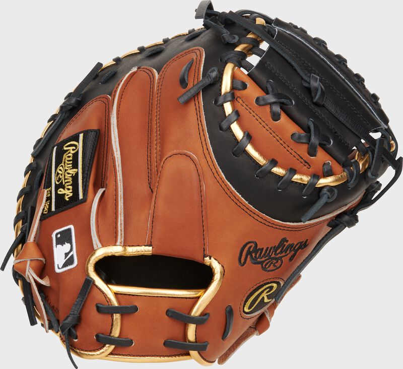 Back of a golden brown/black Heart of the Hide ColorSync 8.0 catcher's mitt with a black 1-Piece solid web - SKU: PROYM4GBB