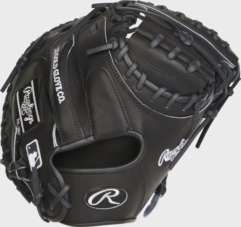Back of a black Heart of the Hide R2G 33" catcher's mitt with a black Oval R on the wrist strap - SKU: RSGPROCM33B loading=