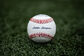 A Rawlings Little League baseball lying in the grass on a field - SKU: RLLB1 image number null