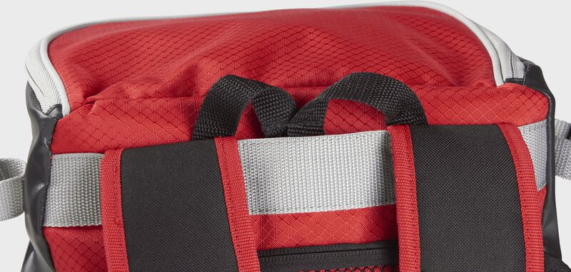 Back carry strap with the hook tucked in its compartment on a scarlet VELOBK Rawlings Velo backpack