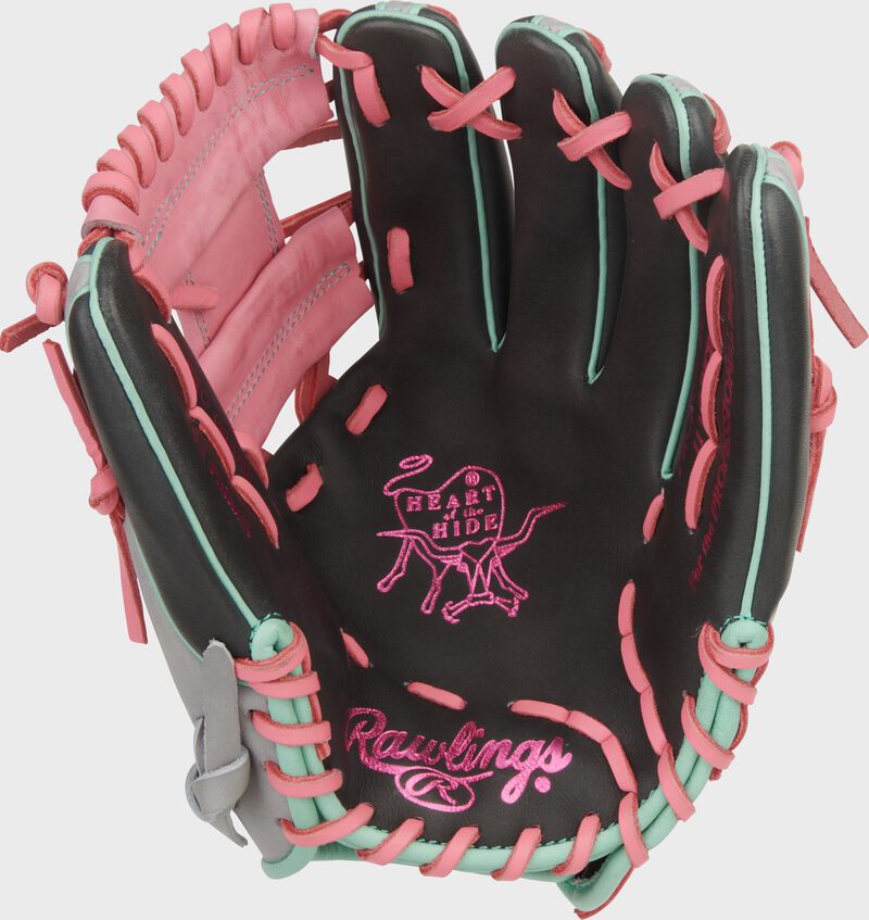 Dark shadow palm of a Rawlings Heart of the Hide 11.5-Inch Infield Glove with pink stamping and laces