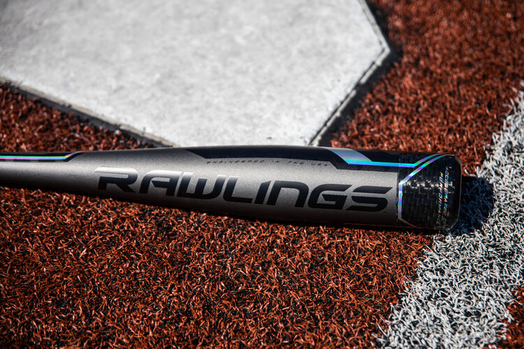Grey barrel of a USA Velo ACP -5 bat lying next to home plate - SKU: USZV5