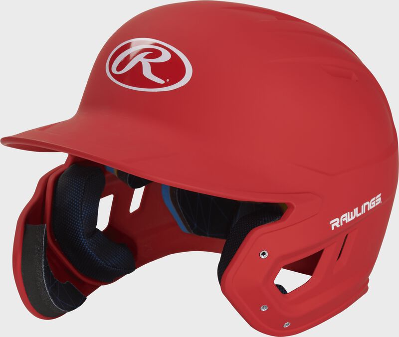 Left angle view of a MACHEXTL Rawlings Mach EXT Junior helmet with a one-tone matte scarlet shell loading=