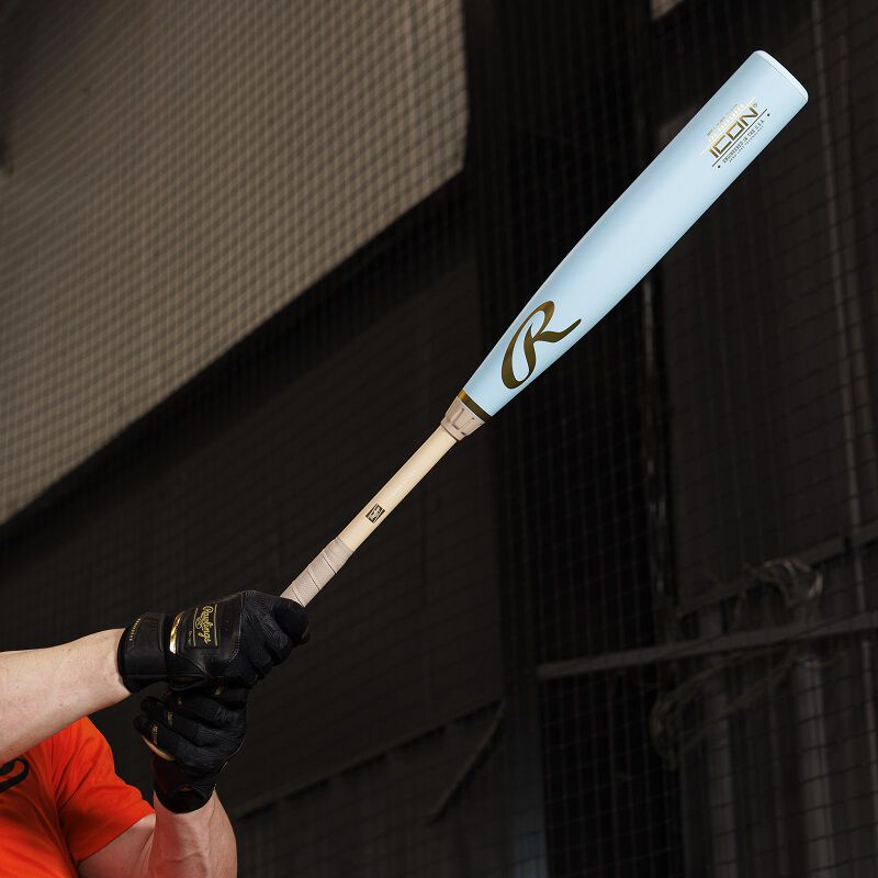A Rawlings Icon Pro Preferred BBCOR baseball bat being held out by a player