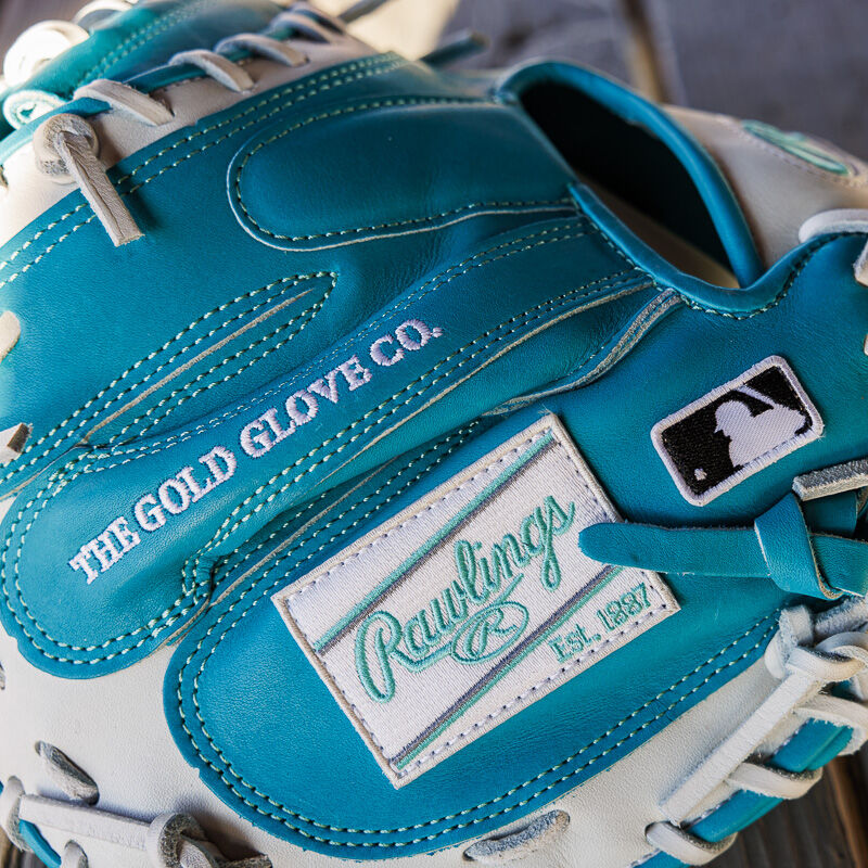 Picture of the white Rawlings patch on a teal exclusive 33" Rawlings R2G Heart of the Hide catcher's mitt