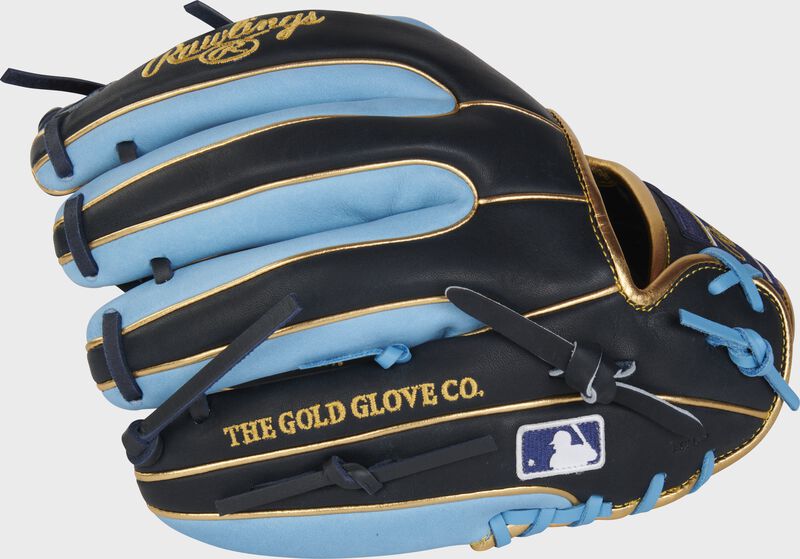 Back of a navy/Columbia blue Heart of the Hide R2G 11.5" infield glove with the MLB logo on the pinky - SKU: PROR314-2NCB