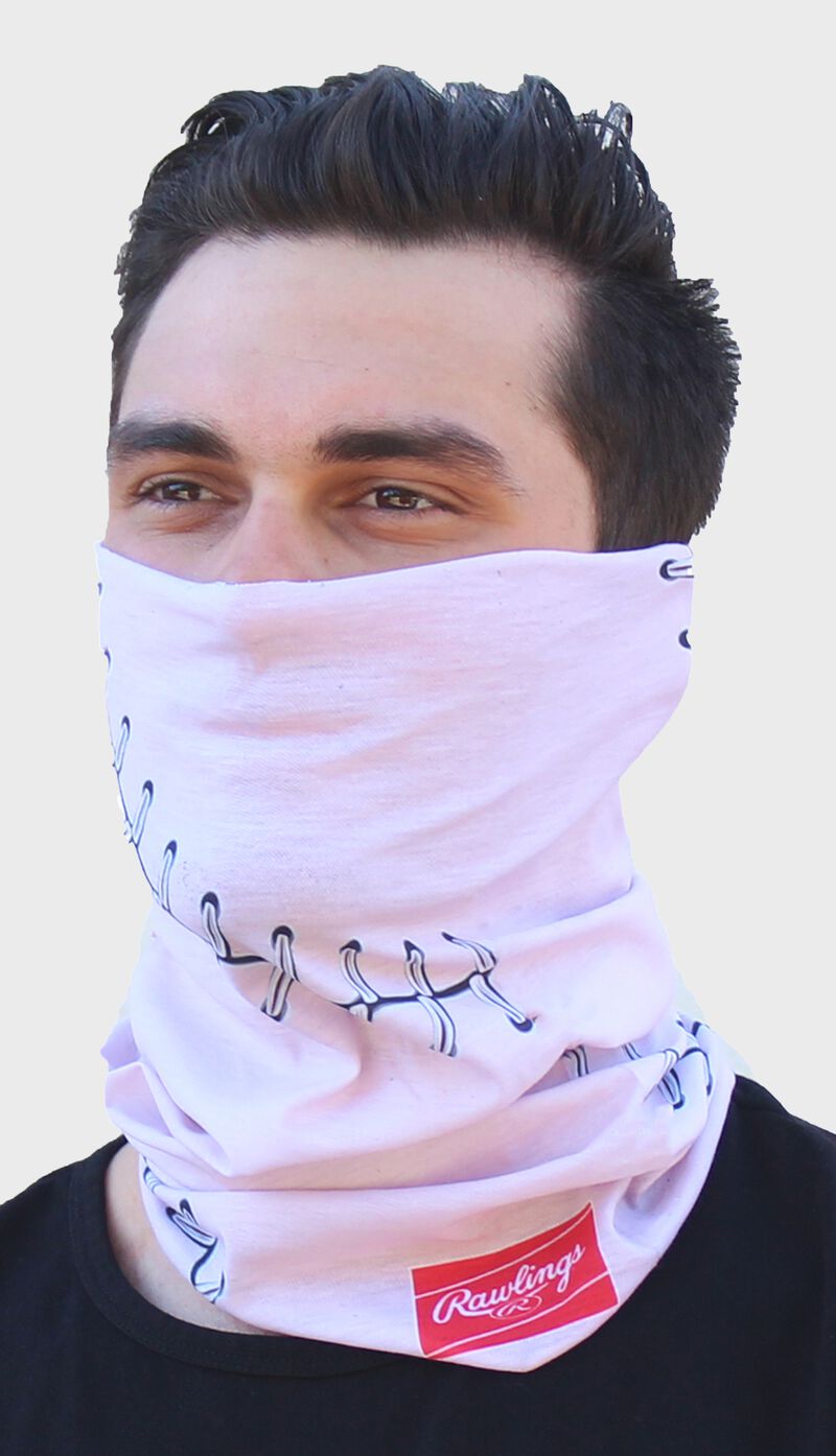 A guy wearing a pink baseball stitch Rawlings multi-functional head and face cover over his mouth and nose - SKU: RC40001-681 loading=