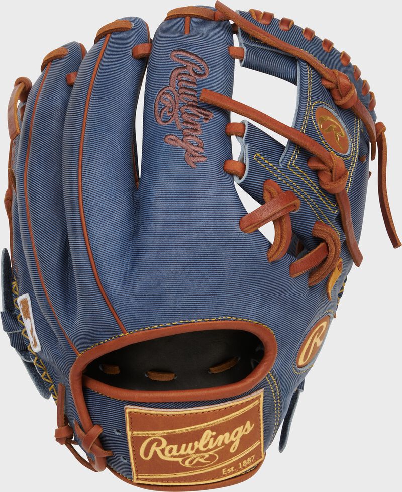 Back of a Heart of the Hide Pro Label Denim infield glove with a tan leather Rawlings patch