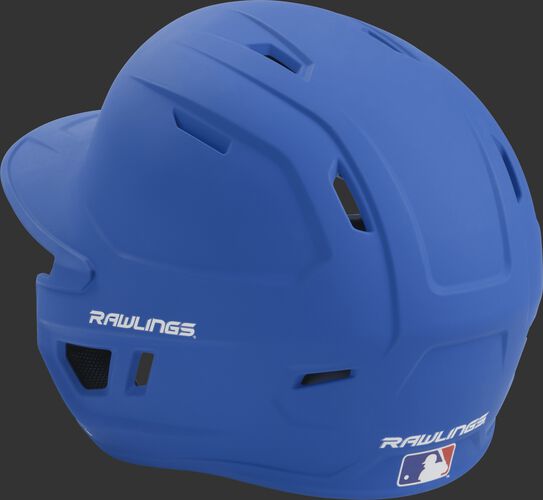 Back left view of a matte royal MACH series batting helmet with air vents