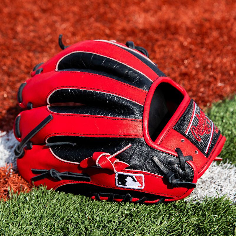 Scarlet/black croc back of a ColorSync 8.0 HOH infield glove on a field
