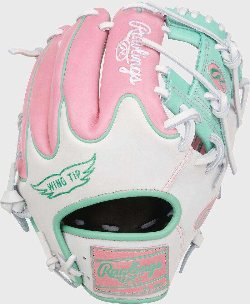 Pink/white Wing Tip back of a Heart of the Hide 11.5" Wing Tip glove with a mint leather Rawlings patch