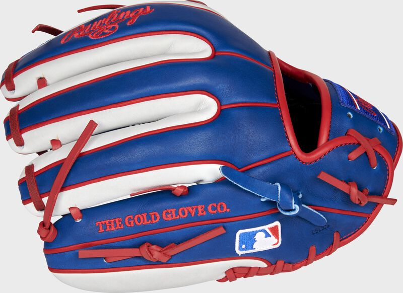 Pinky back view of royal, white, and scarlet 2021 Chicago Cubs Heart of the Hide glove loading=