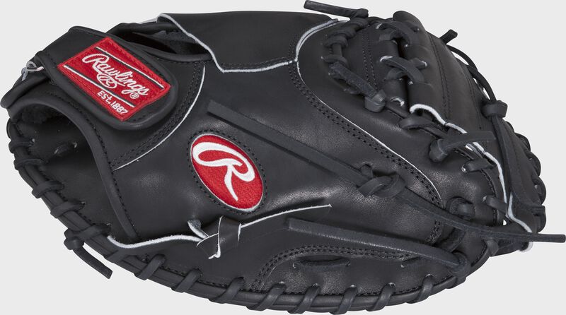 Thumb view of a PROSP13B Heart of the Hide 32.5-inch catcher's mitt with a black one-piece solid web