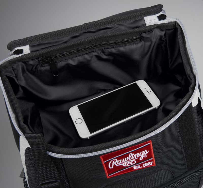 Top accessory pocket of a black R500 equipment backpack holding a phone