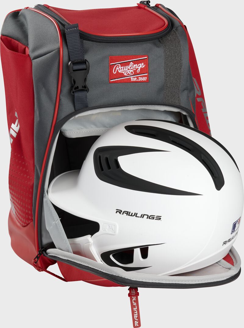 A white/black helmet in the main compartment of a scarlet Rawlings Franchise backpack - SKU: FRANBP-S