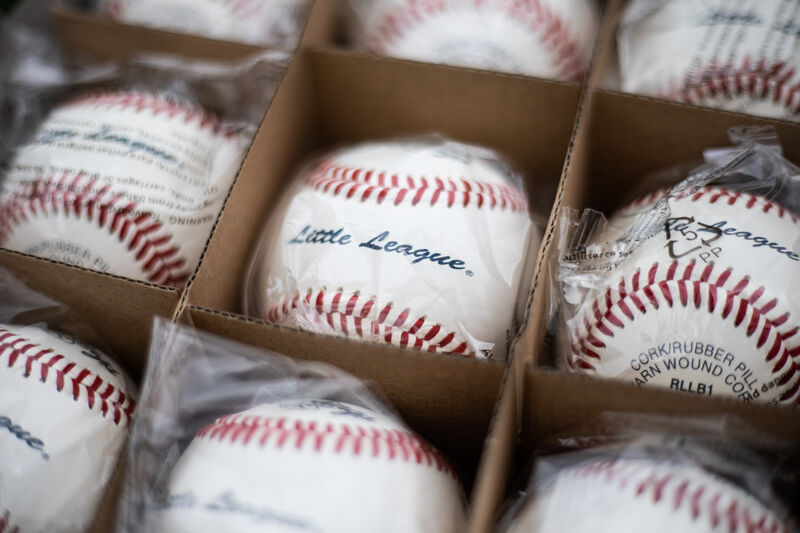 A Rawlings Little League baseball in a box of balls - SKU: RLLB1