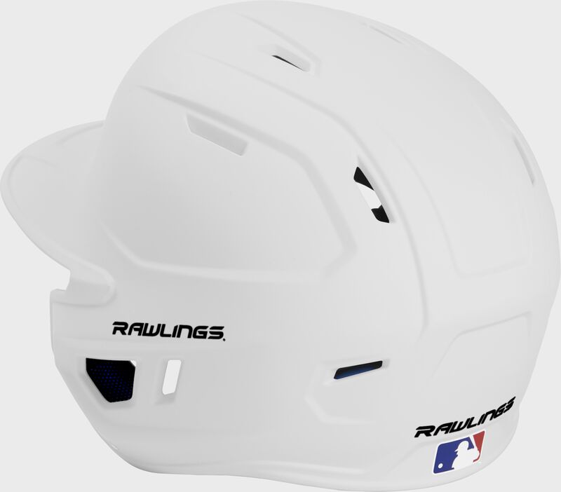 Back left view of a matte white MACHEXTL MACH series batting helmet with air vents