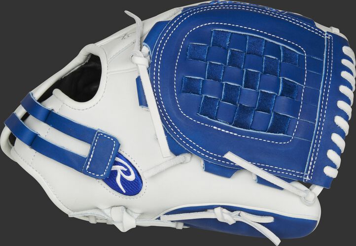 Thumb of a white RLA120-3R Liberty Advanced Color Series 12-inch infield/pitcher's glove with a royal Basket web