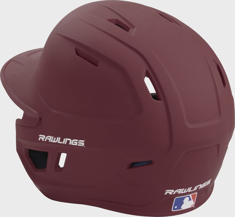Back left view of a matte maroon MACH series batting helmet with air vents