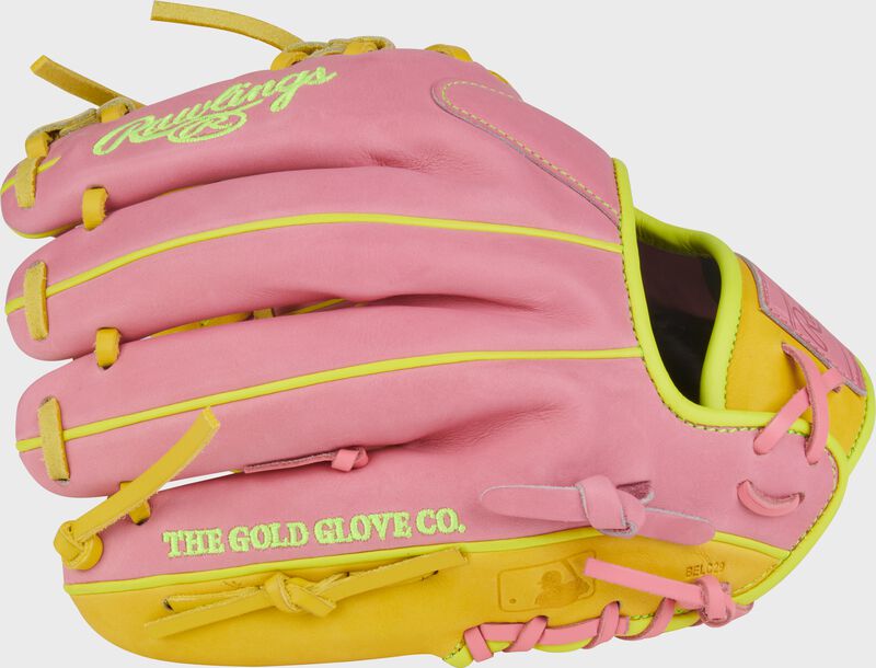 Back of a pink/yellow Heart of the Hide ContoUR Fit 11.5-Inch ink infield glove with the MLB logo on the pinky