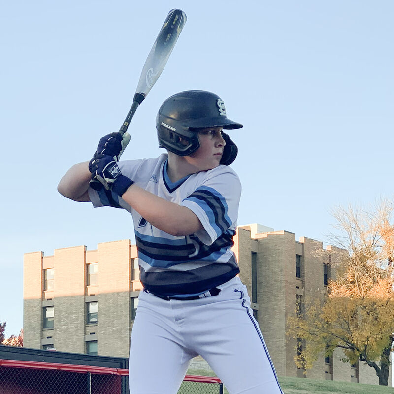 A player in a batting stance with a Rawlings Icon USA Baseball bat - SKU: RUS3I10