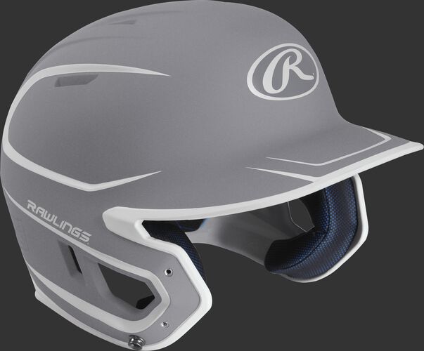 Right angle view of a matte MACH Senior batting helmet with a silver/white shell