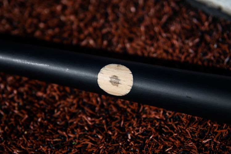 Pro Ink Dot on a Pro Label Khris Davis bat lying on a field - SKU: KD2PL