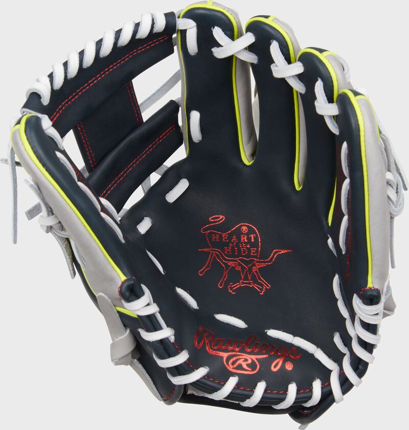 Navy palm of a Rawlings Xander Bogaerts Heart of the Hide glove with red palm stamping and white laces