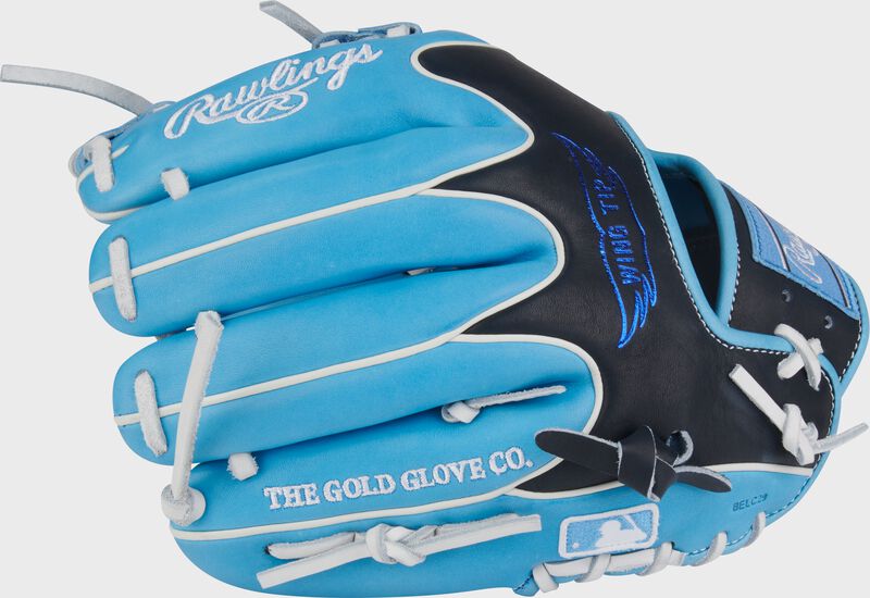 Wing tip back of a Columbia blue/black Rawlings Heart of the Hide 11.75-Inch Wing Tip Infield Glove with the MLB logo on the pinky