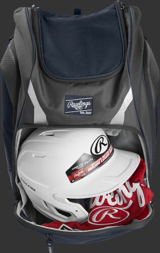A navy Legion backpack with a helmet and other gear in the main compartment - SKU: LEGION-N