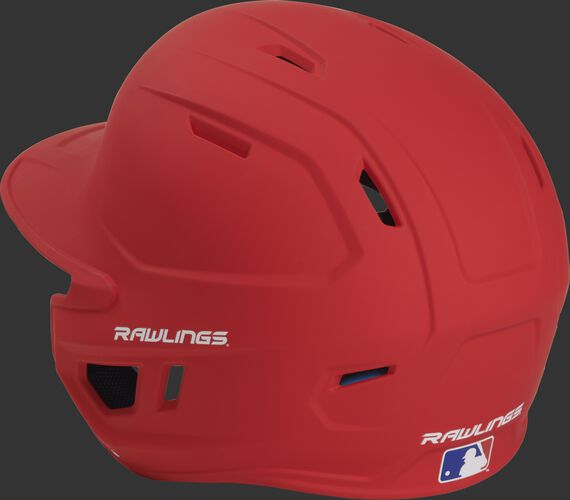 Back left view of a matte scarlet MACHEXTL MACH series batting helmet with air vents