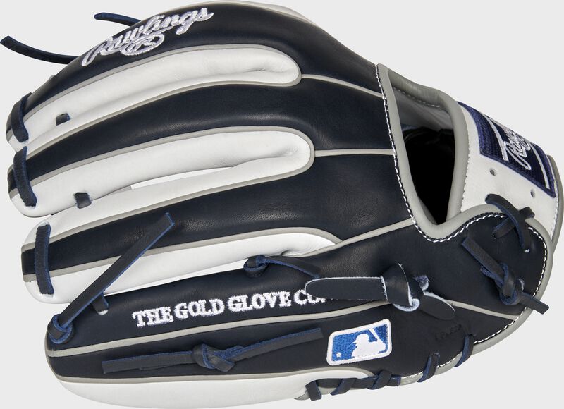 Pinky back view of navy and white 2021 New York Yankees Heart of the Hide glove loading=