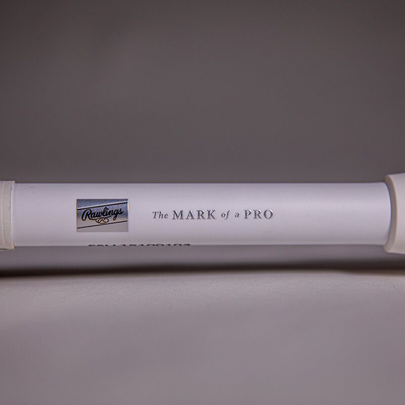 A silver Rawlings patch and "The Mark of a Pro" on a handle - SKU: RFP3MP