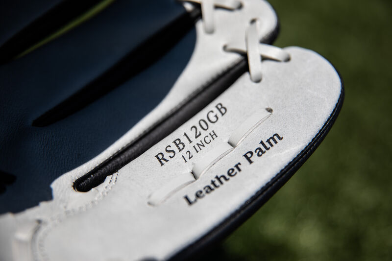 Grey pinkie with sku stamp on a RSB series glove with grass in the background - SKU: RSB120GB