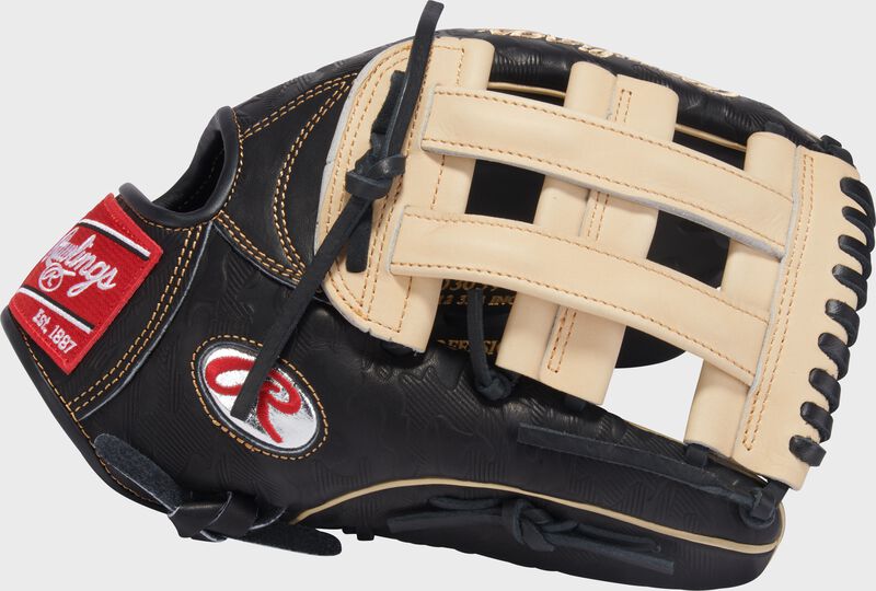Thumb of a black/camel Gameday 57 Series Fernando Tatís Jr. Heart of the Hide Glove with a platinum Oval-R and camel H-web